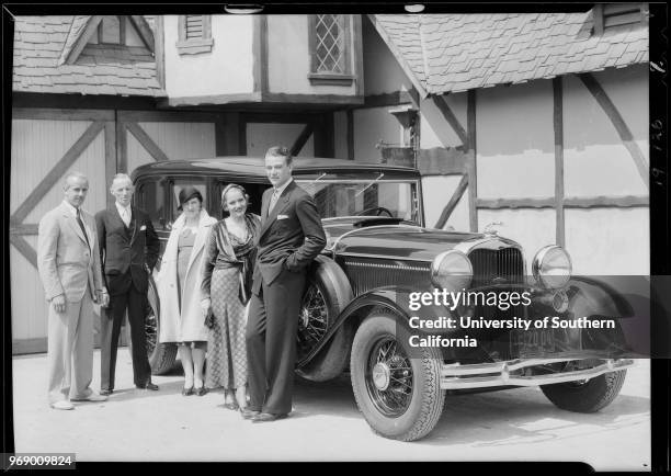 Photograph of Lincoln automobile, Constance Cummings, John Wayne, woman and men, Southern California, 1931.