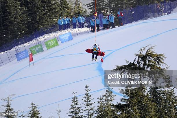 Romania's Edith Miklos is airlifted after a crash during the Women's Vancouver 2010 Winter Olympics Downhill event at Whistler Creek side Alpine...