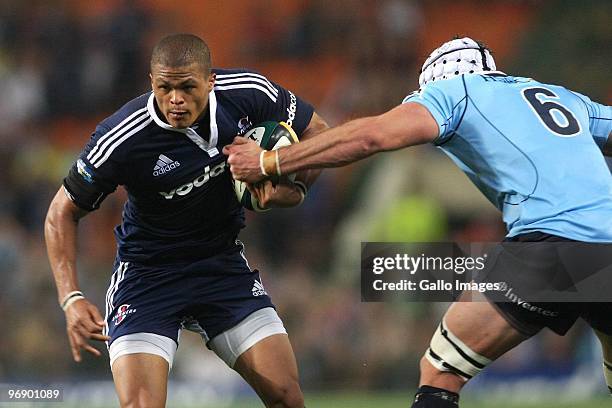 Juan De Jongh from the Stormers gets past Ben Mowen from the Waratahs attempted tackle during the Super 14 match between Vodacom Stormers and HSBC...