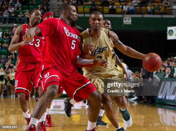 Chris Howard of the South Florida Bulls drives as Sean Evans of the St John's Red Storm defends during the game at the SunDome on February 20, 2010...