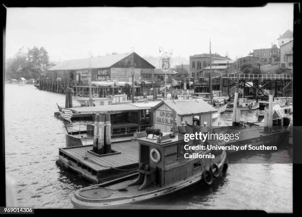 Pleasure boats with Union Oil station on dock, Nanaimo, British Columbia, Canada, 1935.