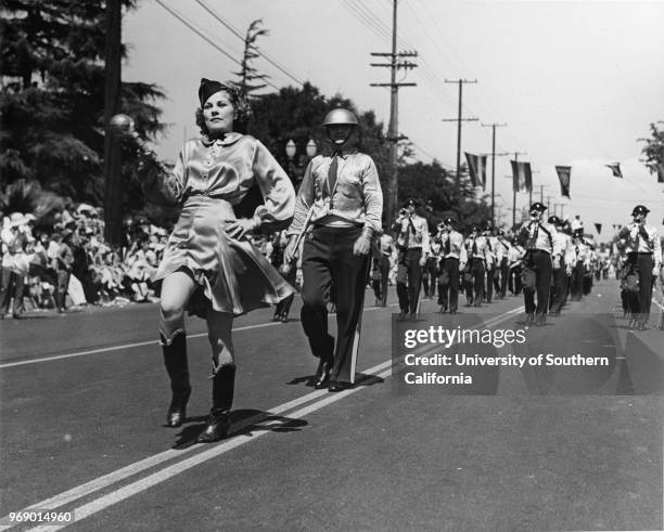 American Legion parade, bugle corps led by drum major and drum majorette, Long Beach, California, early to mid twentieth century.