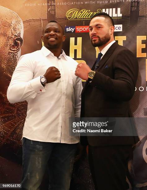 Dillian Whyte and Joseph Parker pose for photographs after the Dillian Whyte and Joseph Parker Press Conference at The Dorchester Hotel on June 7,...