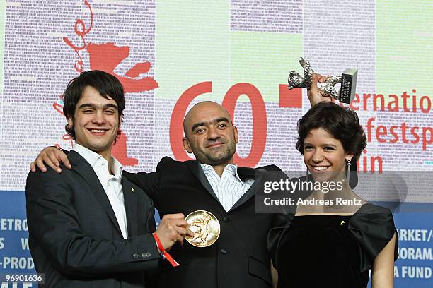 Director Florin Serban holds his Silver Bear Jury Grand Prix Award with actress Ada Condeescu and actor George Pistereanu at the 'Award Winners'...