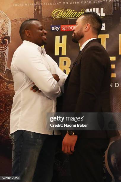 Dillian Whyte and Joseph Parker pose for photographs after the Dillian Whyte and Joseph Parker Press Conference at The Dorchester Hotel on June 7,...