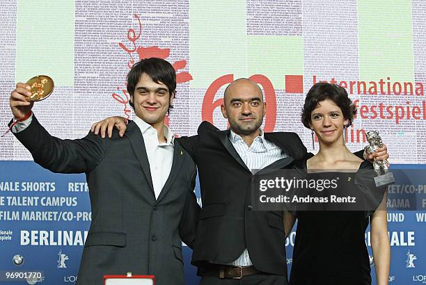 Director Florin Serban holds his Silver Bear Jury Grand Prix Award with actress Ada Condeescu and actor George Pistereanu at the 'Award Winners'...