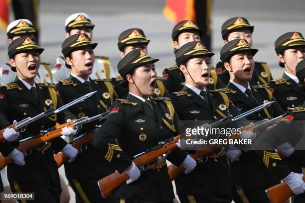 Members of a military honour guard march during a welcome ceremony for Kazakhstan's President Nursultan Nazarbayev, outside the Great Hall of the...