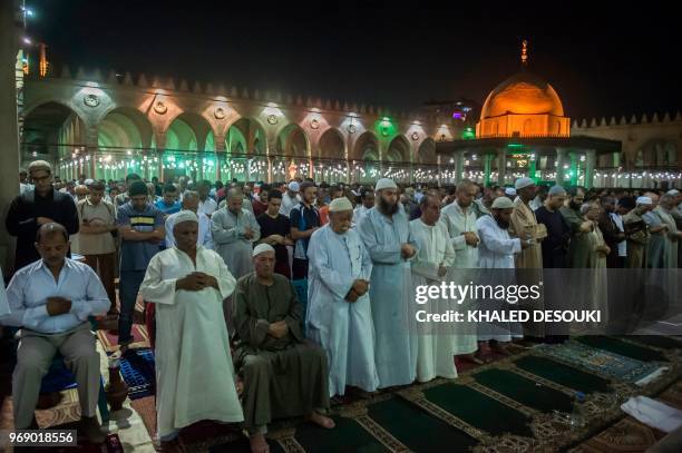 Egyptians chant the Tarawih recitations on the occasion of Laylat al-Qadr during the fasting month of Ramadan at Cairo's historic mosque of Amr Ibn...