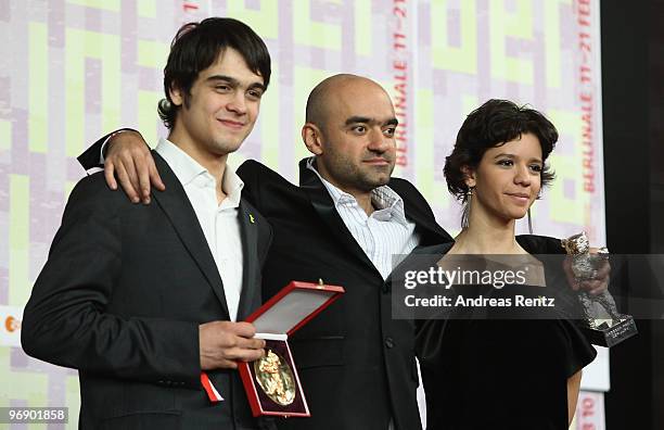 Director Florin Serban holds his Silver Bear Jury Grand Prix Award with actress Ada Condeescu and actor George Pistereanu at the 'Award Winners'...