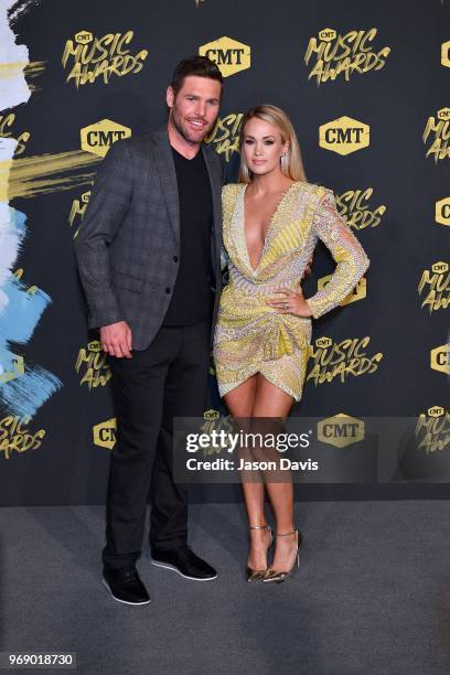 Mike Fisher and Carrie Underwood arrive at the 2018 CMT Music Awards at Bridgestone Arena on June 6, 2018 in Nashville, Tennessee.