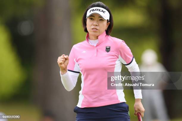 Shiho Oyama of Japan celebrates after making her birdie putt on the 9th hole during the first round of the Suntory Ladies Open Golf Tournament at the...