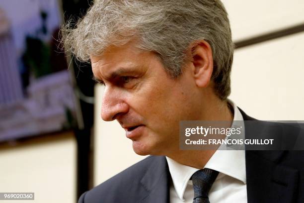 Of the French multinational dairy products corporation Lactalis Emmanuel Besnier looks on as he arrives to face an inquiry commission over baby milk...