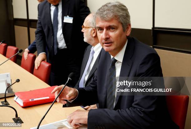 Of the French multinational dairy products corporation Lactalis Emmanuel Besnier looks on as he arrives to face an inquiry commission over baby milk...