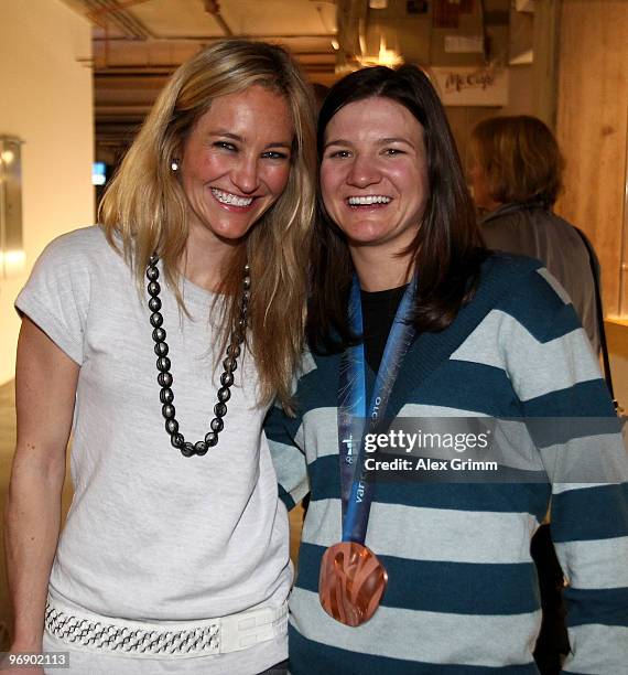 Snowboarders Gretchen Bleiler and Kelly Clark pose together at USA House on February 19, 2010 during the Olympic Winter Games in Vancouver, Canada.