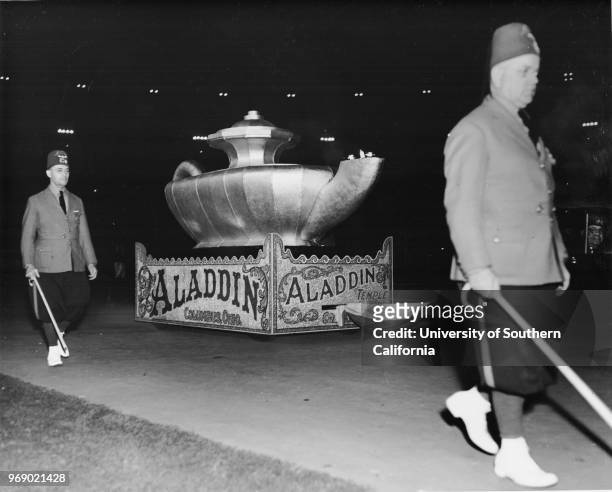 Shriner's night time parade, float representing Aladdin's lamp from the Aladdin Temple, Columbus, Ohio, accompanied by two unidentified Shriners, Los...