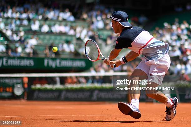 Argentina's Diego Schwartzman returns the ball to Spain's Rafael Nadal during their men's singles quarter-final match on day twelve of The Roland...