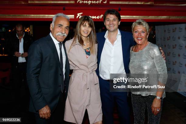 Mansour Bahrami, Gabrielle Boetsch, Arnaud Boetsch and Frederique Bahrami attend "Diner des Legendes" at Le Fouquet's on June 6, 2018 in Paris,...