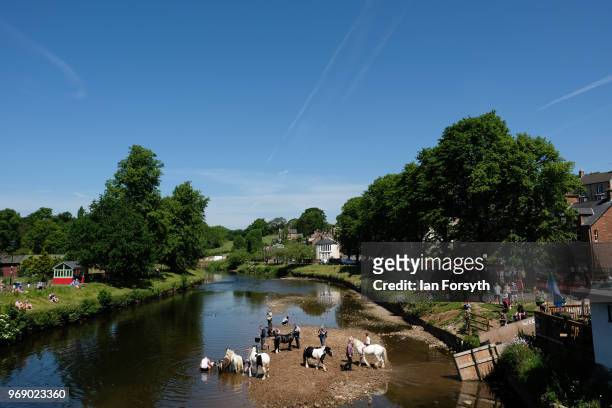 Horses are washed in the river Eden on the first day of the Appleby Horse Fair on June 7, 2018 in Appleby, England.The fair is an annual gathering...