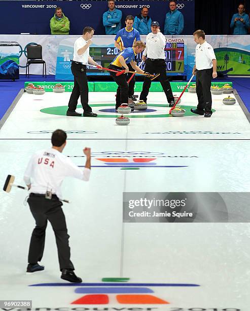 John Shuster, Jason Smith, Jeff Isaacson, and John Benton of the USA celebrate after defeating Niklas Edin, Sebastian Kraupp, Fredrik Lindberg, and...