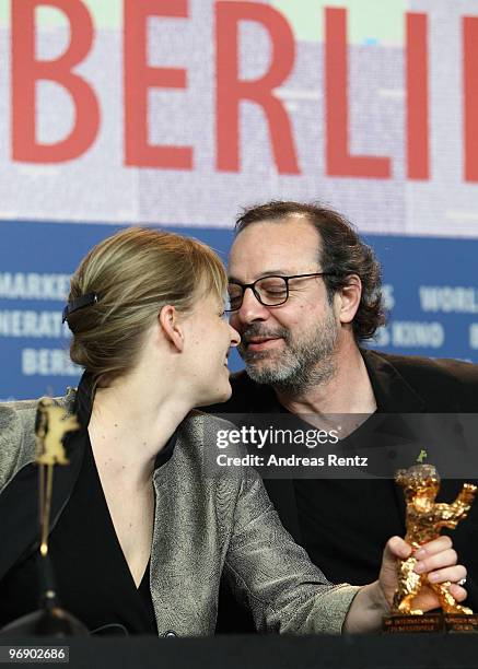 Co-producer Bettina Brokemper and director Semih Kaplanoglu pose with the Golden Bear Award for Best Film at the 'Award Winners' Photocall during day...