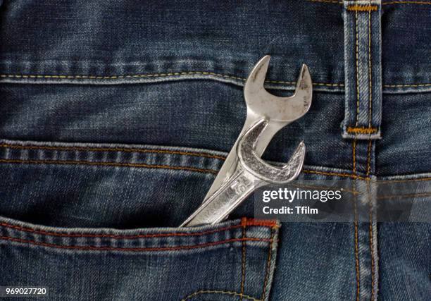 wrench in back pocket jean - hosentasche stock-fotos und bilder