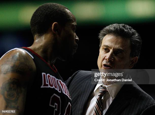 Head coach Rick Pitino of the Louisville Cardinals gives instructions to Jerry Smith during a game against the DePaul Blue Demons at the Allstate...