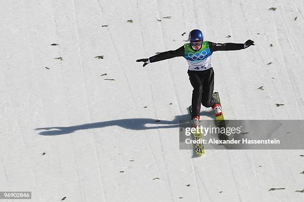 Adam Malysz of Poland lands after his final jump on the Large Hill on day 9 of the 2010 Vancouver Winter Olympics at Ski Jumping Stadium on February...