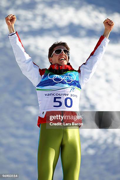 Simon Ammann of Switzerland celebrates his Gold medal after the final jump the Large Hill on day 9 of the 2010 Vancouver Winter Olympics at Ski...