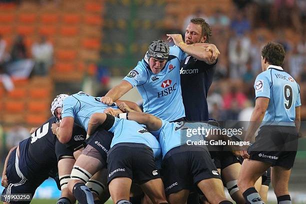 Ben Mowen from the Waratahs and Andries Bekker from the Stormers compete in the rolling mule during the Super 14 match between Stormers and Waratahs...