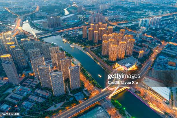aerial view of residential building and ferris wheel - xie liyao stock pictures, royalty-free photos & images