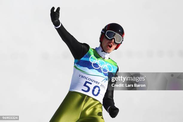 Simon Ammann of Switzerland celebrates after coming to a landing after the final jump the Large Hill on day 9 of the 2010 Vancouver Winter Olympics...