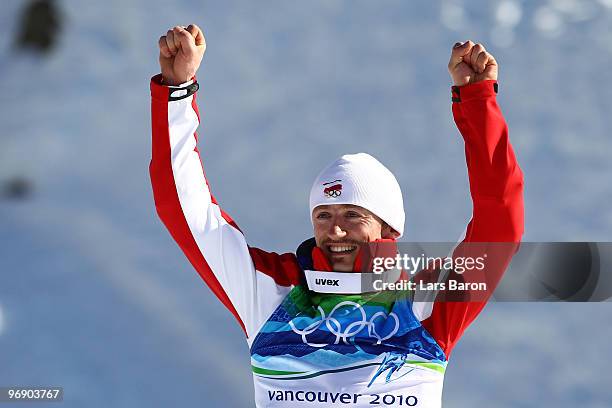 Adam Malysz of Poland celebrates after winning the Silver medal on the Large Hill during day 9 of the 2010 Vancouver Winter Olympics at Ski Jumping...