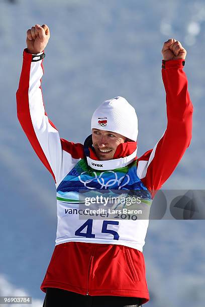 Adam Malysz of Poland celebrates after winning the Silver medal on the Large Hill during day 9 of the 2010 Vancouver Winter Olympics at Ski Jumping...