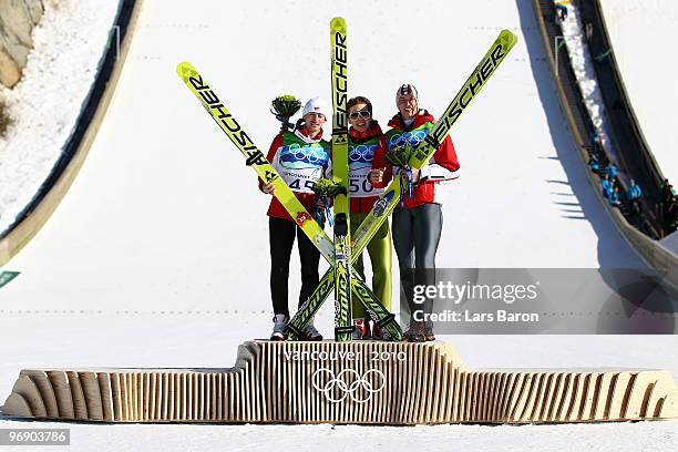 Simon Ammann of Switzerland celebrates his Gold medal, Adam Malysz of Poland Silver and Gregor Schlierenzauer of Austria Bronze after the final jump...