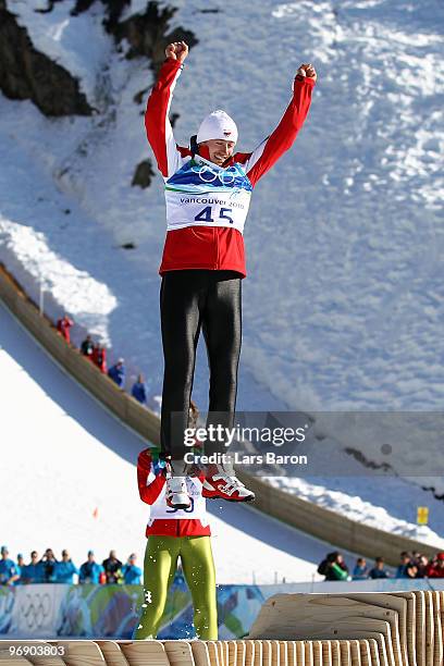 Adam Malysz of Poland celebrates after winning the Silver medal on the Large Hill during day 9 of the 2010 Vancouver Winter Olympics at Ski Jumping...
