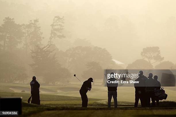 Professional football player Tony Romo tees off on the second hole during round three of the AT&T Pebble Beach National Pro-Am at Pebble Beach Golf...