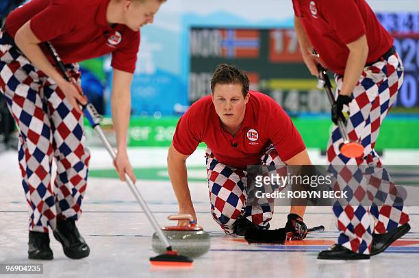 Norway's Christoffer Svae watches his stone against Denmark in the curling round robin session 7 match, during the 2010 Winter Olympics in Vancouver,...