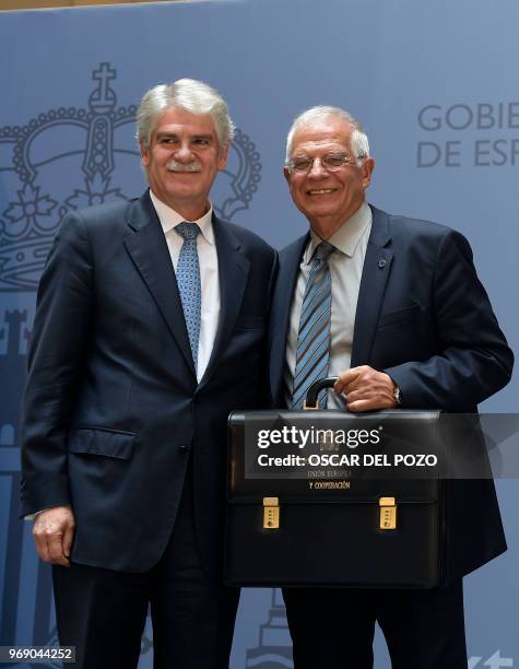 The new Spanish minister of foreign affairs Josep Borrell and former minister of foreign affairs Alfonso Dastis attend the portfolio handover...