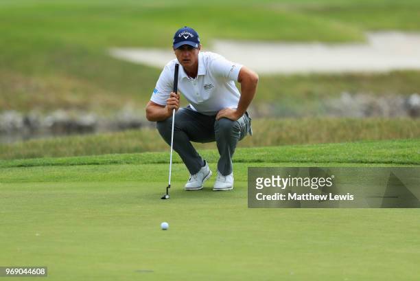 Nicolas Colsaerts of Belgium lines up a putt on the 1st green during day one of the 2018 Shot Clock Masters at Diamond Country Club on June 7, 2018...