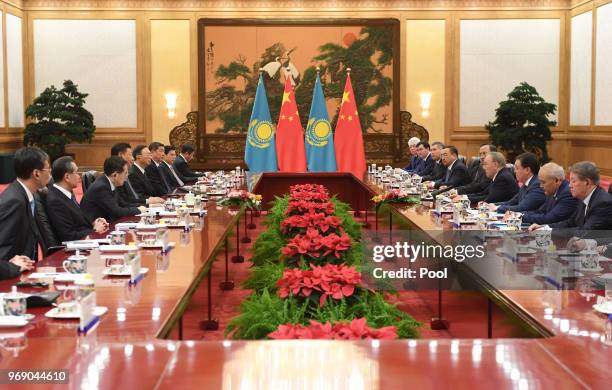 Kazakhstan's President Nursultan Nazarbayev speaks during a meeting with Chinese President Xi Jinping in the Great Hall of the People on June 7...