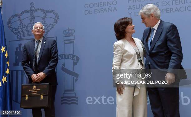 The new Spanish minister of foreign affairs Josep Borrell stands beside former minister of foreign affairs Alfonso Dastis speaking the new Deputy...