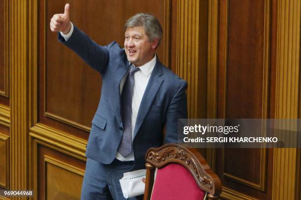 Ukrainian finance minister Oleksandr Danylyuk reacts after he was dismissed by the Ukrainian parliament in Kiev on June 7, 2018. - A total of 254...