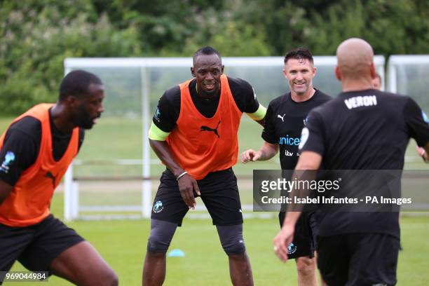 World XI's Yaya Toure, Usain Bolt, Robbie Keane and Juan Sebastian Veron during the World XI team's training session for Soccer Aid for UNICEF at...