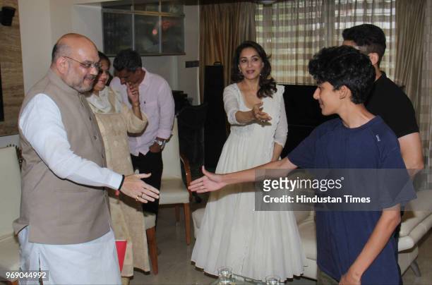 President Amit Shah meets Bollywood actor Madhuri Dixit with her husband Sriram Nene at her residence as part of his party’s Sampark se Samarthan...