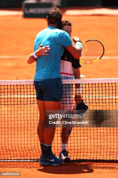 Diego Schwartzman of Argentina congratulates Rafael Nadal of Spain on victory following their mens singles quarter finals match during day twelve of...