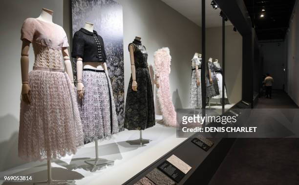 Picture taken on June 7, 2018 shows mannequins wearing lace clothes on display at the City of Lace during an exhibition dubbed "Haute dentelle" in...