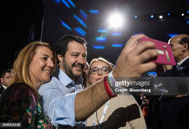 Matteo Salvini, Italy's deputy prime minister, takes a selfie photograph with attendees before the annual general meeting of the Confcommercio retail...