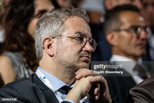 Claudio Borghi, economic adviser for the League, listens during the annual general meeting of the Confcommercio retail association in Rome, Italy, on...
