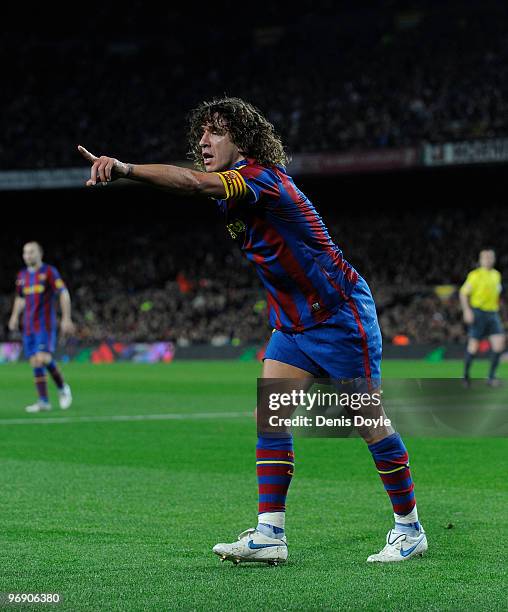 Carles Puyol of Barcelona points for a corner kick to be taken during the La Liga match between Barcelona and Racing Santander at Camp Nou stadium on...