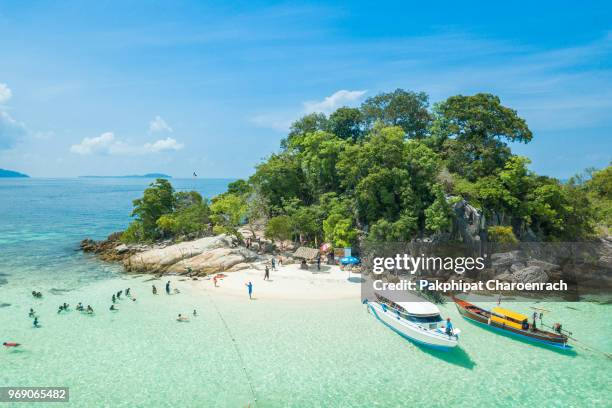 aerial view of unidentified tourists enjoy and relax on the white sand beach at koh rok roy or koh rokroy (rok roy island), lipe island, tarutao national marine park, satun province, thailand. - ko lipe stock pictures, royalty-free photos & images